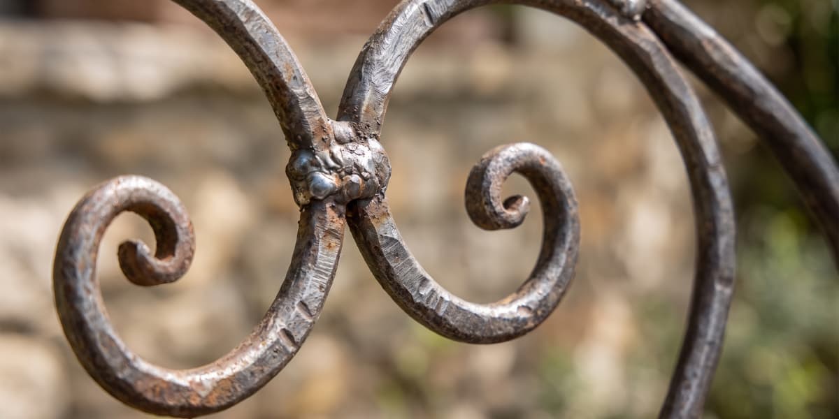 wrought-iron-scrollwork-detail-outdoor-chair wrought-iron-scrollwork-detail-outdoor-chair